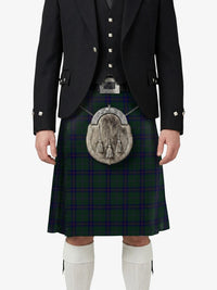 Person wearing a traditional Scottish kilt with a dark jacket on a white background
