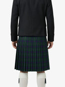 Person wearing a black jacket and plaid kilt on a white background