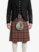 Person wearing a red tartan kilt with a black jacket on a white background