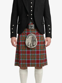 Person wearing a red tartan kilt with a black jacket on a white background