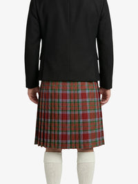 Person wearing a black jacket and red plaid kilt on a white background