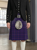 Person wearing a traditional Scottish kilt with a visible tartan pattern and a jacket.
