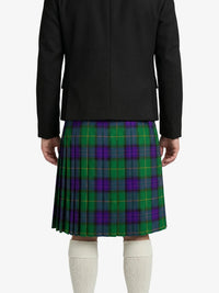 Person wearing a black jacket and green plaid kilt on a white background