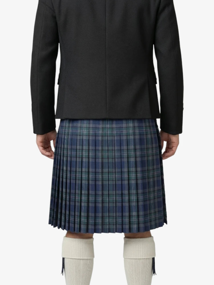 Person wearing a black coat and blue plaid kilt on a white background
