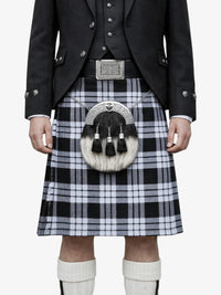 Person wearing a traditional Scottish kilt with a sporran on a white background