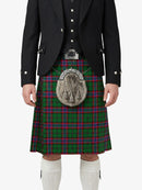 Person wearing a traditional Scottish kilt with a tartan pattern on a white background
