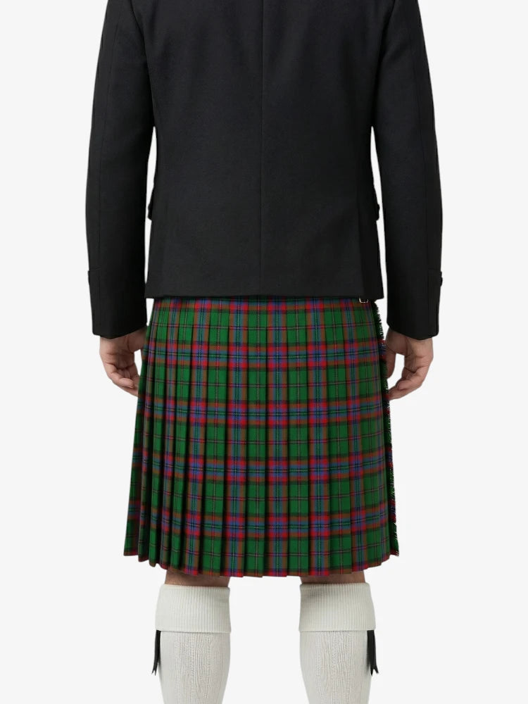 Person wearing a black jacket and green plaid kilt on a white background