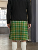 Person wearing a green plaid kilt indoors