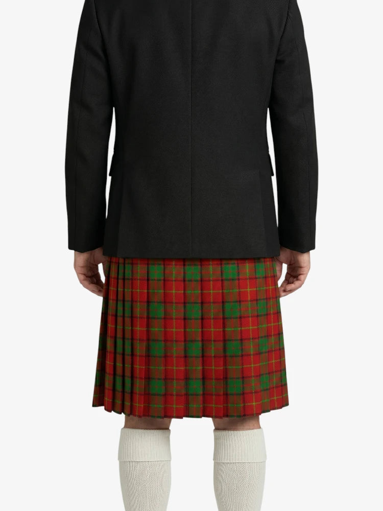 Person wearing a black jacket and red plaid kilt on a white background