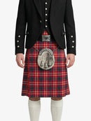 Person wearing a traditional Scottish kilt with a black jacket on a white background