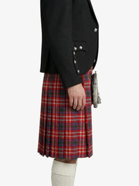 Person wearing a black blazer and red plaid kilt on a white background