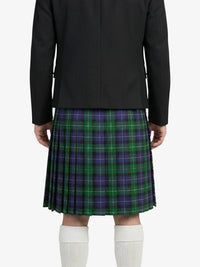 Person wearing a black jacket and green plaid kilt on a white background