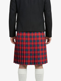 Person wearing a black jacket and red plaid kilt on a white background