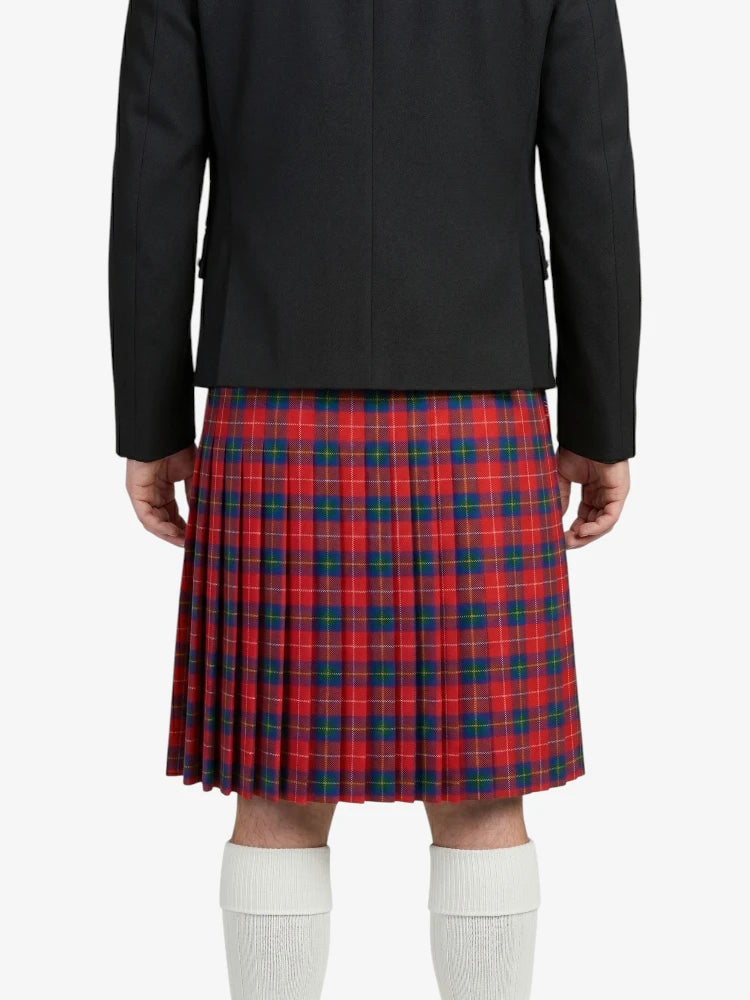 Person wearing a black jacket and red plaid kilt on a white background
