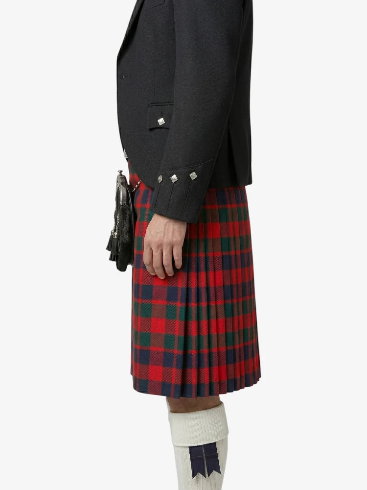Person wearing a black jacket and red plaid kilt on a white background
