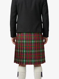 Person wearing a black jacket and red plaid kilt on a white background