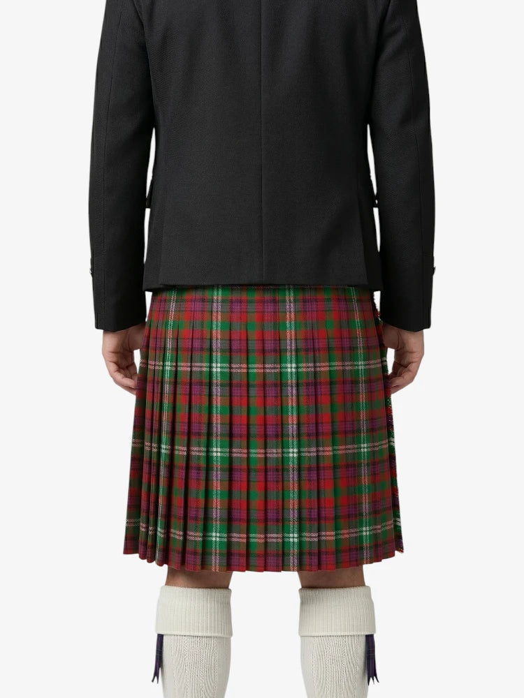 Person wearing a black jacket and red plaid kilt on a white background