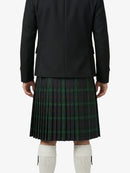 Person wearing a black coat and green plaid kilt on a white background