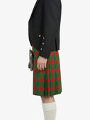 Person wearing a black jacket and red plaid kilt on a white background