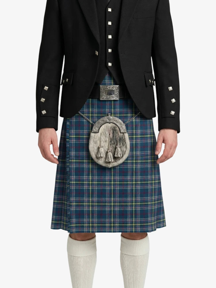 Person wearing a traditional Scottish kilt with a black jacket on a white background
