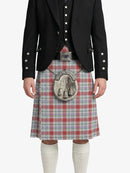 Person wearing a black jacket, red plaid kilt, and white knee-high socks on a white background