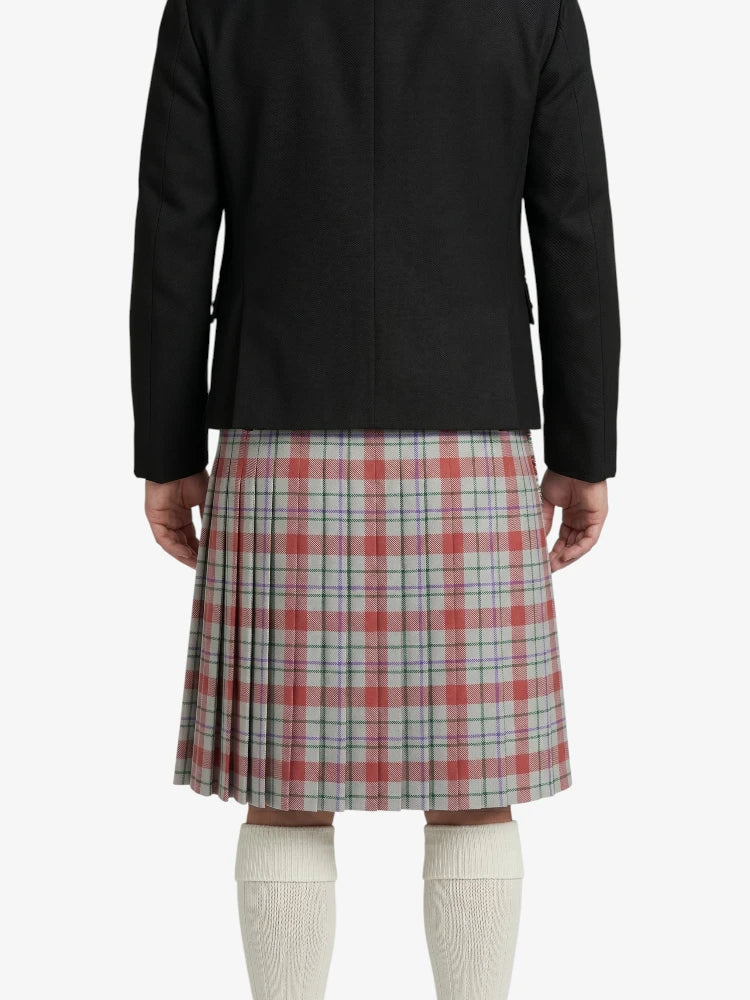 Person wearing a black jacket and plaid skirt on a white background