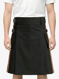 Black skirt with orange accents worn by a person on a white background