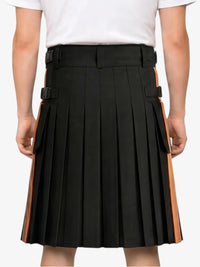 Black pleated skirt with orange accents worn by a person on a white background
