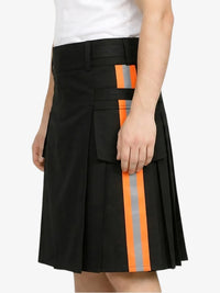 Black kilt with orange and gray stripes worn by a person on a white background