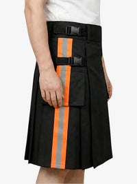 Black kilt with orange and gray stripes worn by a person on a white background