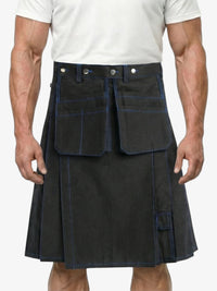 Person wearing a black kilt with white buttons on a plain background
