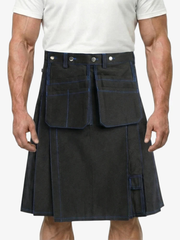 Person wearing a black kilt with white buttons on a plain background