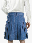 Person wearing a blue denim kilt with a white shirt on a white background