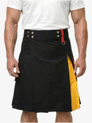 Black kilt with red and yellow accents worn by a person on a white background
