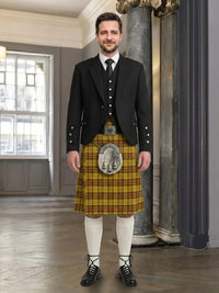Man wearing a traditional Scottish kilt with a backdrop of a room with a window.