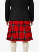 Person wearing a black coat and red plaid kilt on a white background
