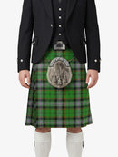 Person wearing a traditional Scottish kilt with a tartan pattern on a white background
