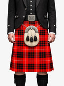 Person wearing a red tartan kilt with a black jacket on a white background