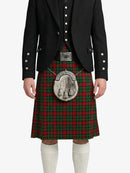 Person wearing a traditional Scottish kilt with a tartan pattern on a white background