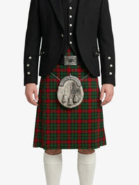 Person wearing a traditional Scottish kilt with a tartan pattern on a white background