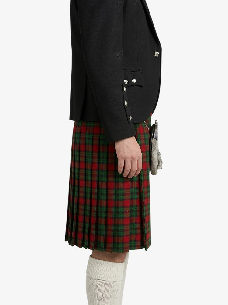 Person wearing a black jacket and red plaid kilt on a white background