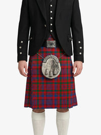 Person wearing a red tartan kilt with a black jacket on a white background