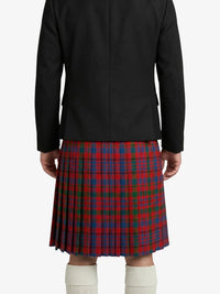 Person wearing a black jacket and red plaid kilt on a white background