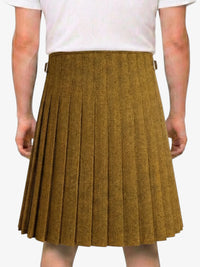 Brown pleated skirt worn by a person on a white background