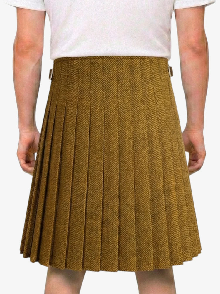 Brown pleated skirt worn by a person on a white background