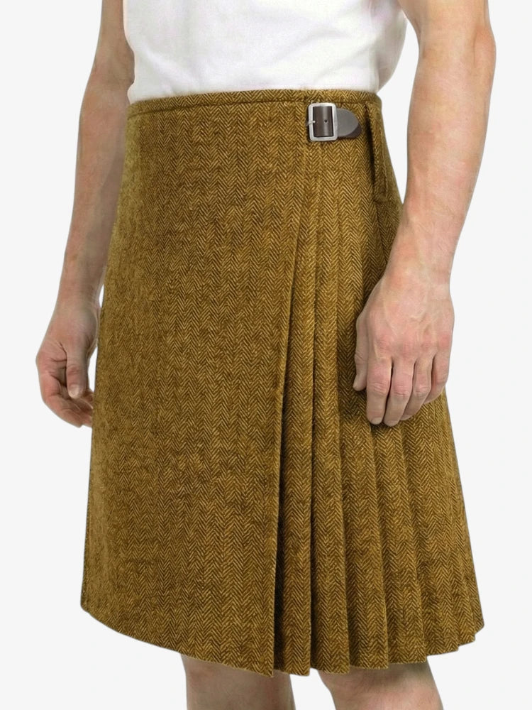Brown herringbone skirt worn by a person on a white background