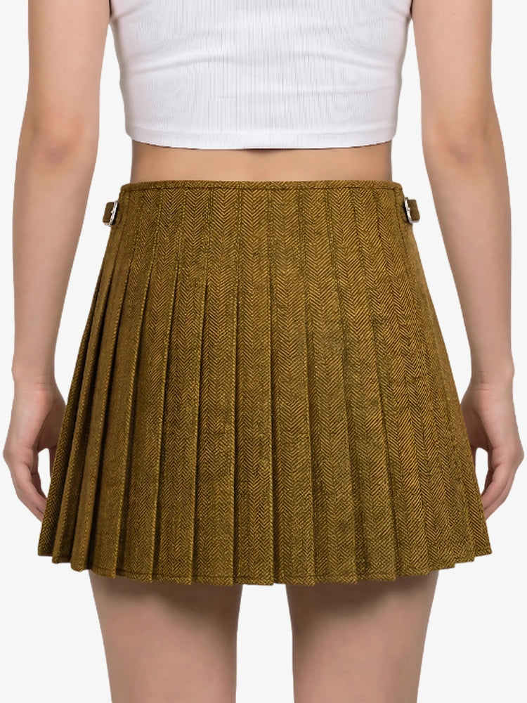 Brown pleated skirt worn by a person on a white background