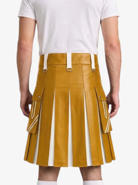 A mustard yellow faux-leather kilt with white vertical pleats and side cargo pockets, shown on a model from the back wearing a white t-shirt.