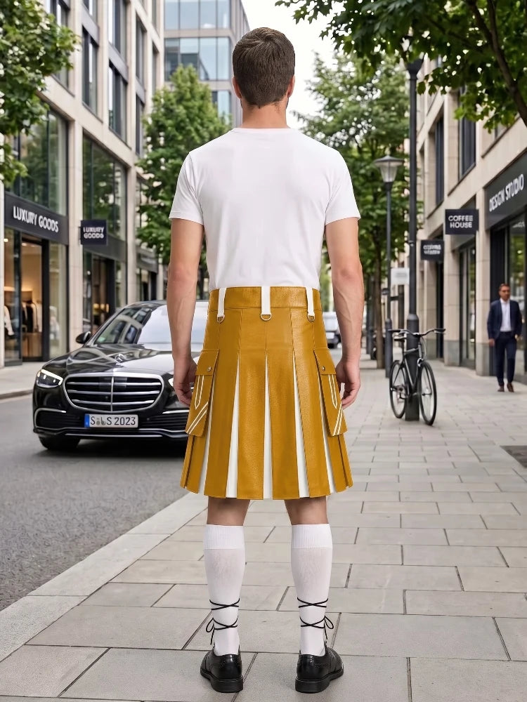 A man stands on a city sidewalk facing away from the camera, wearing a white short-sleeve T-shirt and a mustard yellow pleated kilt-style skirt with white vertical stripe panels, white knee-high socks, and black shoes. Storefronts, trees, a black car, and a bicycle are visible in the urban background.