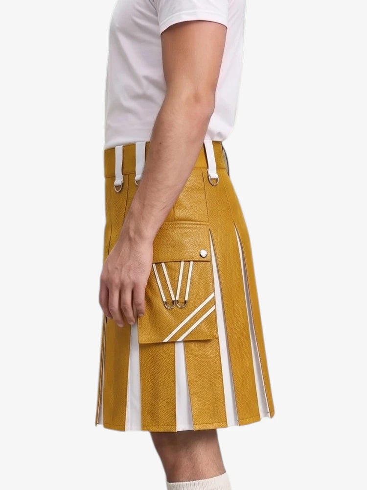 A mustard yellow faux-leather kilt with white contrast panels and white drawstring details, shown on a model wearing a white t-shirt against a light gray background.
